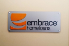 Embrace wall sign