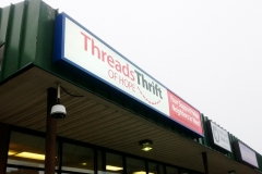 Threads Thrift wall sign